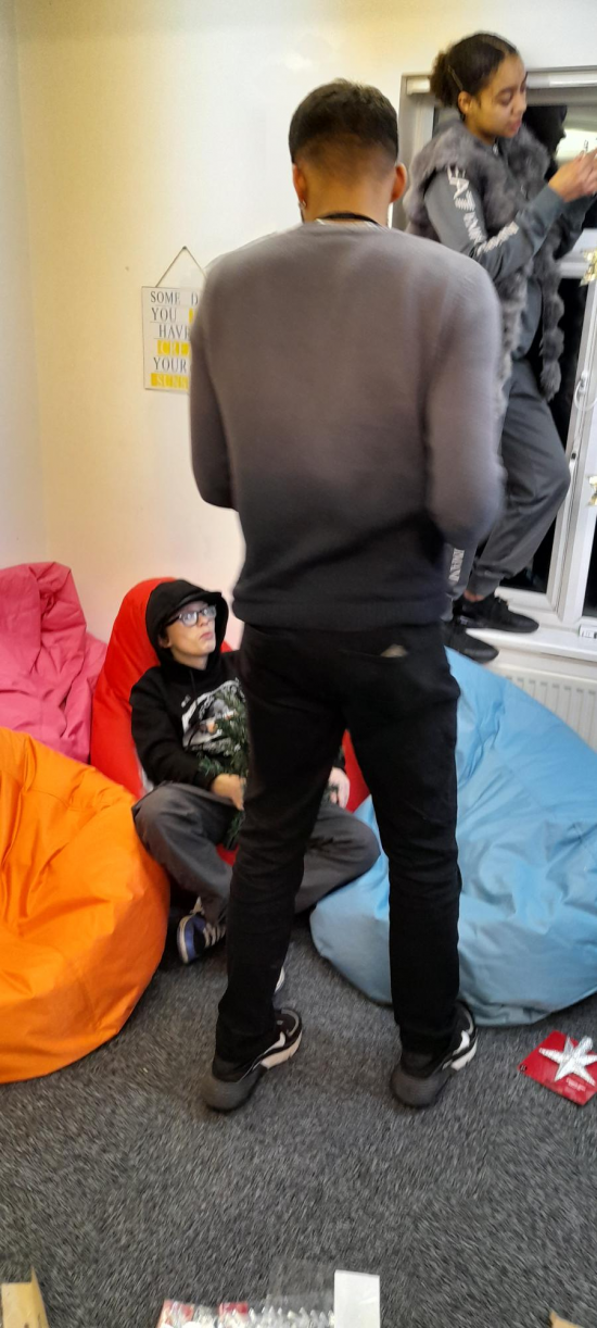 Young people decorating the House Project at Christmas